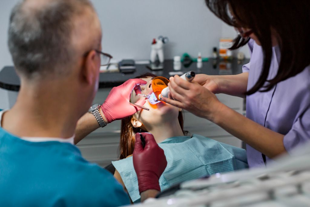 Dental team performing a restorative procedure at a Lemont, IL dental office.