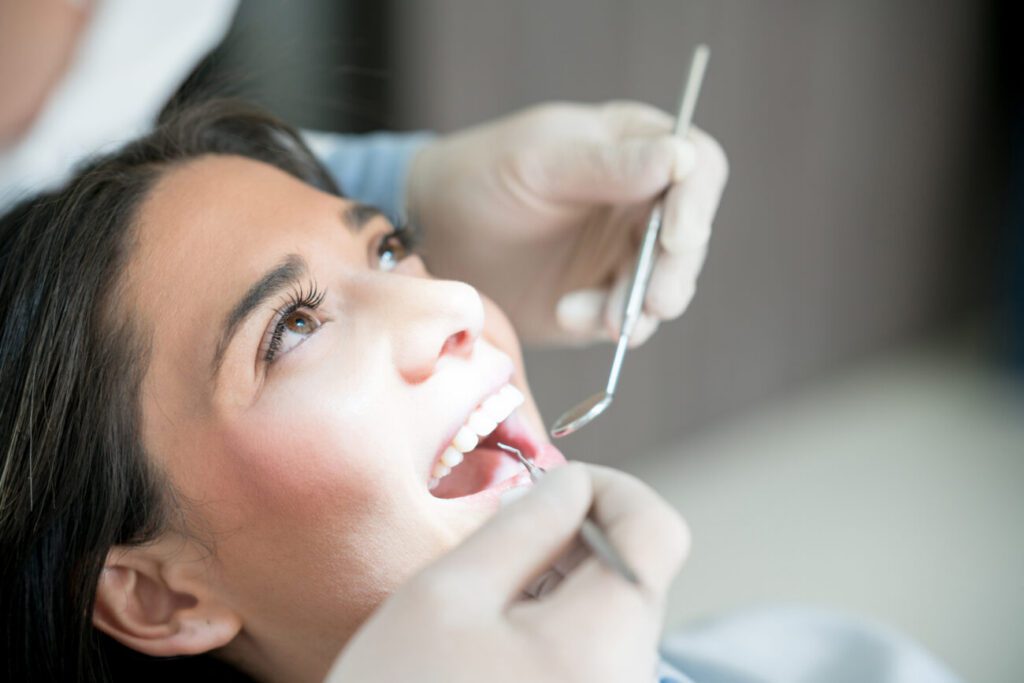Patient receiving a routine dental exam at a family dental office in Lemont, Illinois.